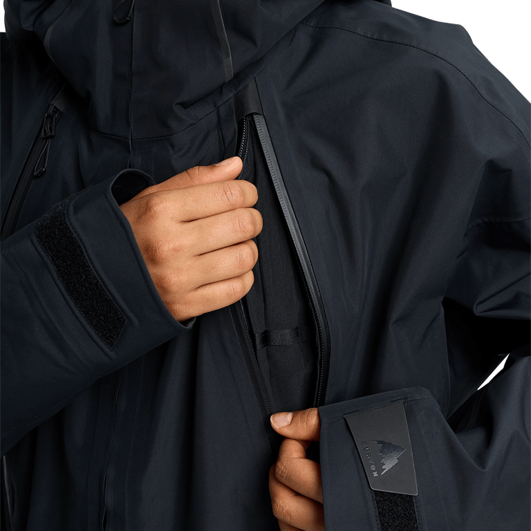 Black Burton Futuretrust 3L Snowboard Jacket detail showing waterproof chest zipper and adjustable velcro cuffs.