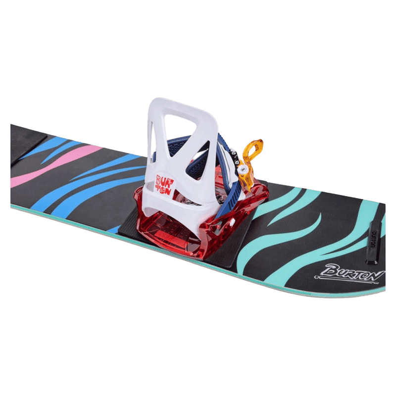 White and red Burton Grom kids snowboard binding with blue strap and orange buckle mounted on a patterned snowboard.