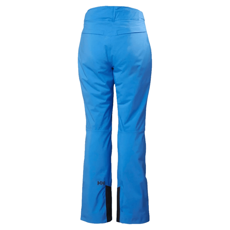Back view of bright blue Helly Hansen Legendary Insulated Ski Pants for women with black reinforced inner ankles.
