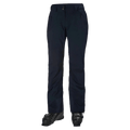 Navy blue Helly Hansen Legendary insulated women's ski pants with zippered pockets, shown from the front with ski boots.