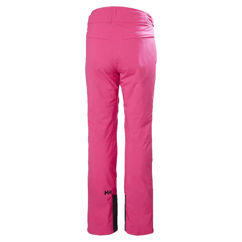 Bright pink Helly Hansen Legendary women's ski pants, back view showing HH logo and reinforced lower leg cuffs.