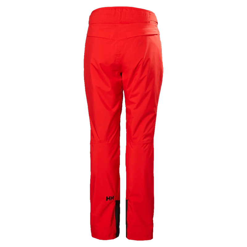 Back view of red Helly Hansen Legendary Insulated Ski Pants for women with a black HH logo on the lower leg.