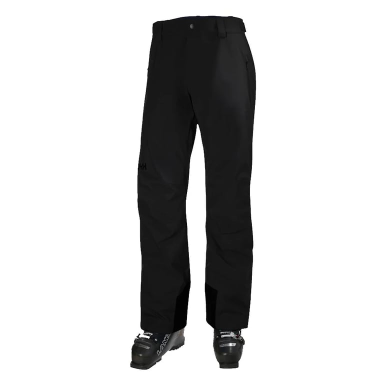 Black Helly Hansen Legendary Insulated Ski Pants with reinforced cuffs, shown from a front angle with ski boots.