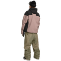 Rear view of olive green Volcom Kleveland snowboard pants featuring a relaxed fit and zippered back pocket.