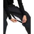 Black Volcom Longo Gore-Tex snowboard pants with a zippered inner thigh vent showing white mesh lining.