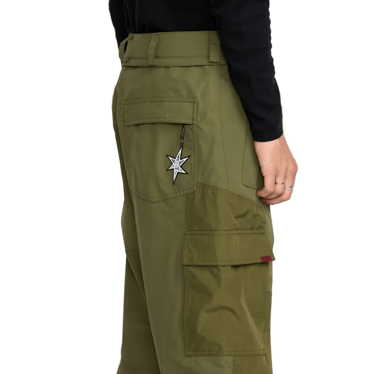Olive green Volcom Longo Gore-Tex snowboard pants with side cargo pocket and white star embroidery on the back pocket.