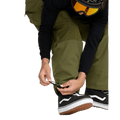 Olive green Volcom Longo Gore-Tex snowboard pants with adjustable bungee cord ankle cuffs.