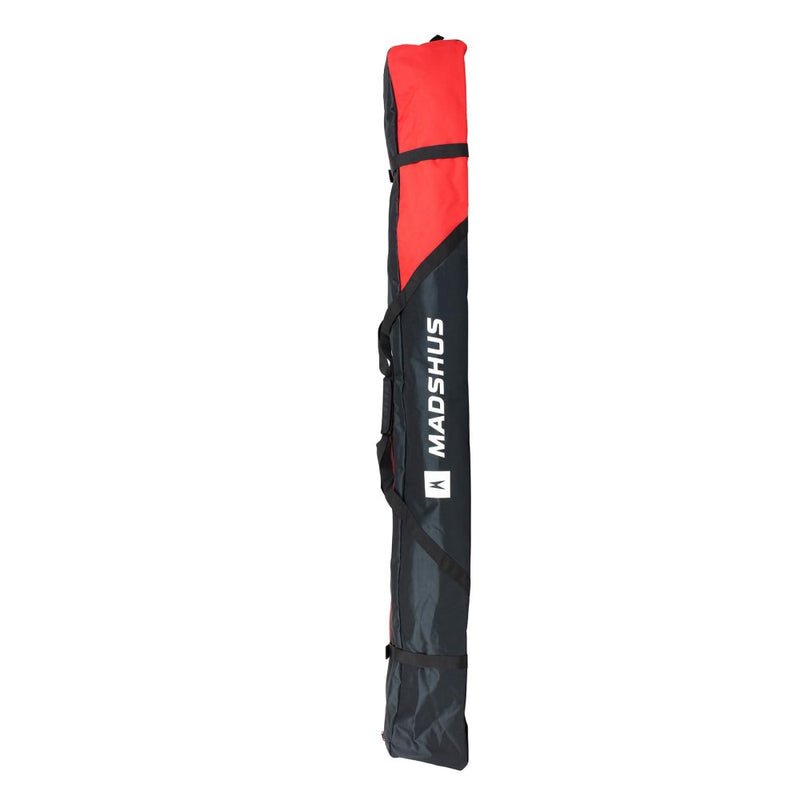 Madshus Cross Country 5-6 ski bag in black and red polyester with a black carry strap and black wrap around securing straps. White lettering.