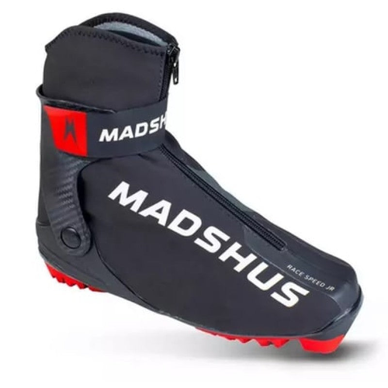 Single Madshus Racespeed junior skate boot in black with red sole plate. Zipper opening. Wrap around hard plastic cuff with red and black Madshus brand. White writing.