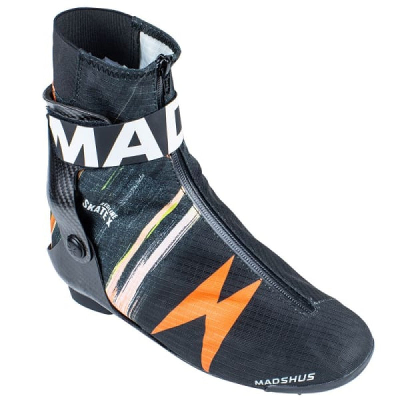 Single Madshus Redline X Skate cross country ski boot with black material, Madshus logo and multi colored strips. Black carbon cuff with velcro strap and zipper closure