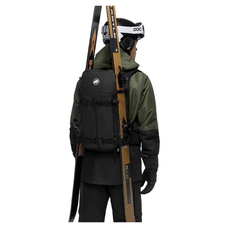 Carried view of the Mammut Nirvana 22L Backpack in black colourway, unisex model