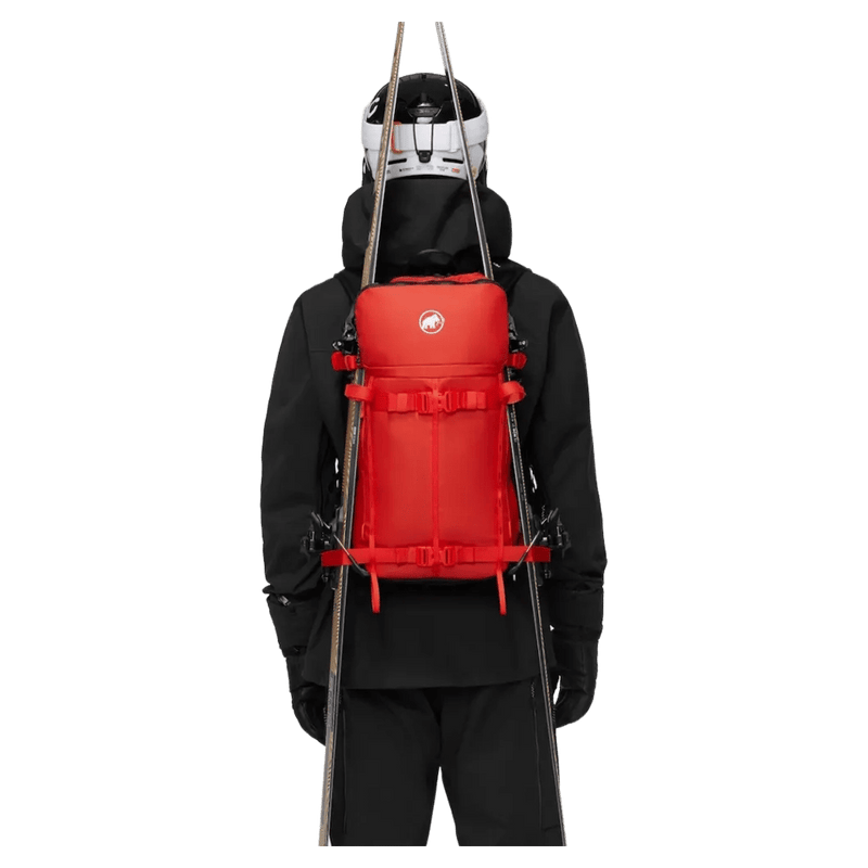 Carried view of the Mammut Nirvana 22L Backpack in mammut red-black colourway, unisex model