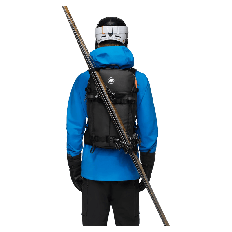 Carried view of the Mammut Nirvana 28 Backpack in black colourway, unisex model