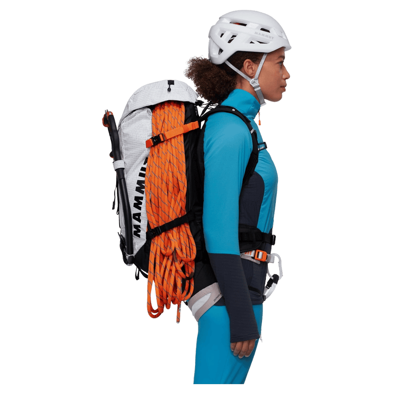 Carried view of the Mammut Trion 38L Backpack in Black White colourway, women model
