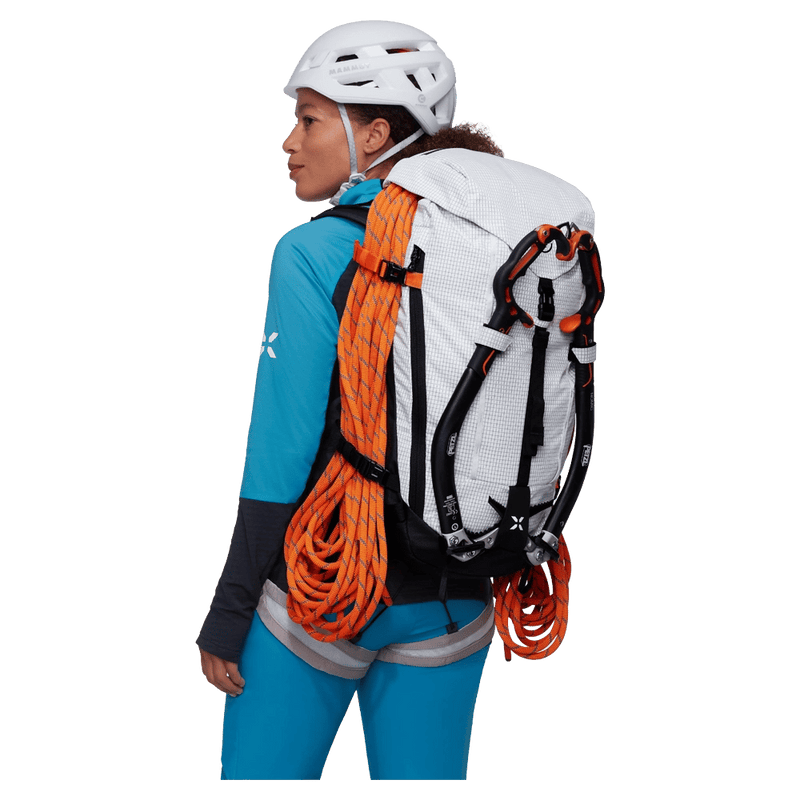 Back, carried view of the Mammut Trion 38L Backpack in Black White colourway, women model