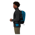 Side view of the Mamut Lithium 15 Backpack in Sapphire Black colourway, unisex's model