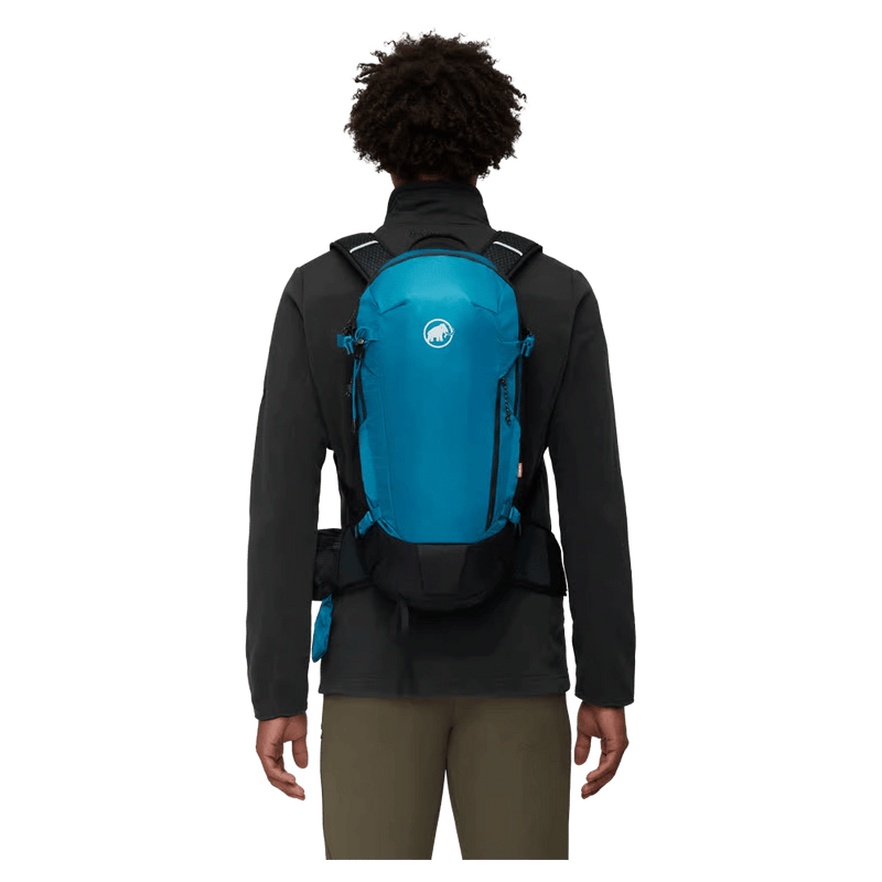 Carried view of the Mamut Lithium 15 Backpack in Sapphire Black colourway, unisex's model
