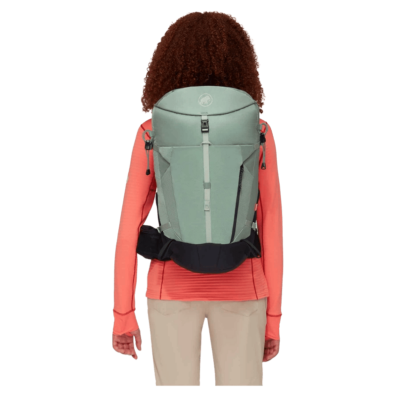 Carried view of the Mamut Lithium 30L Backpack in Jade Black colourway, women's model