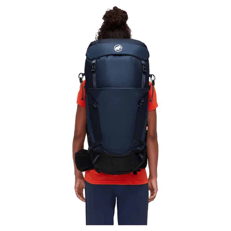 Carried view of the Mamut Lithium 40L Backpack in Sapphire Black colourway, women's model