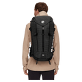 Carried view of the Mamut Trion 38L Backpack in Black colourway, unisex's model