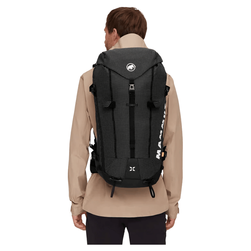 Carried view of the Mamut Trion 38L Backpack in Black colourway, unisex's model