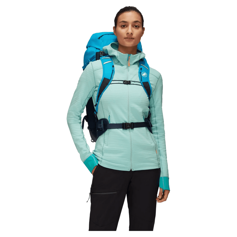 Carried view of the Mamut Trion Nordwand 38L Backpack in Sky and Night colourway, women's model