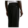 Back view of the Nike Club Cargo Pants in Black colourway, unisex model