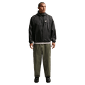 Front view of the Nike Club Cargo Pants in Olive colourway, unisex model