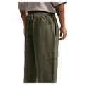 Back view of the Nike Club Cargo Pants in Olive colourway, unisex model