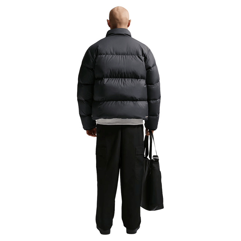 Back view of the Nike Club Down Puffer in Black colourway, unisex model