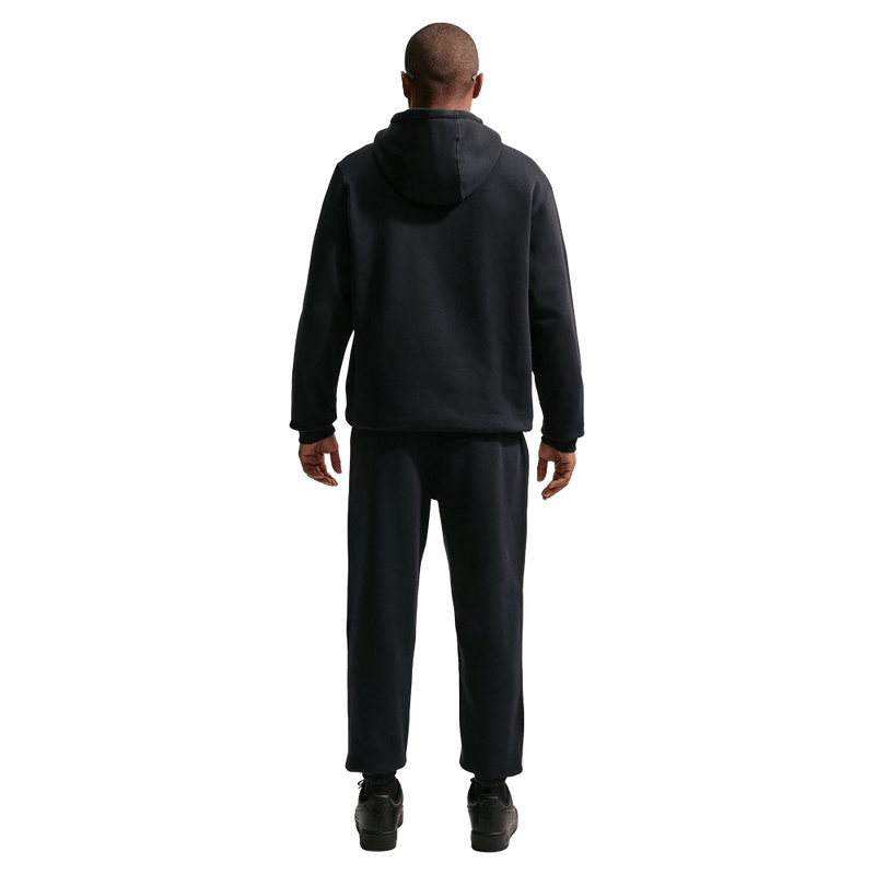 Back view of the Nike Club Fleece Hoodie in Back colourway, unisex model