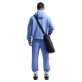 Back view of the Nike Club Fleece Hoodie in Royal Pulse colourway, unisex model
