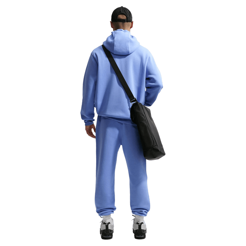 Back view of the Nike Club Fleece Hoodie in Royal Pulse colourway, unisex model