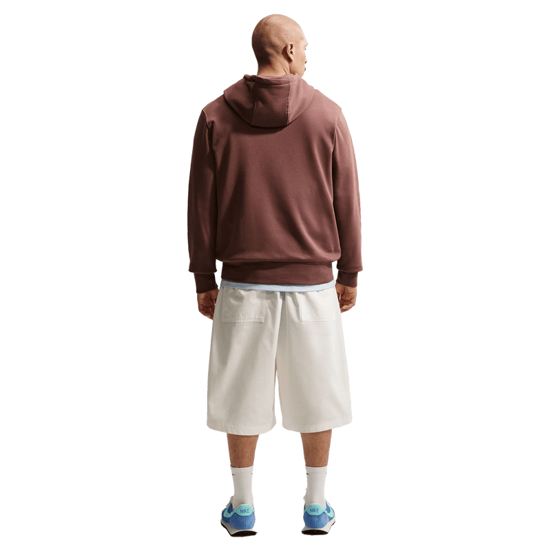 Back view of the Nike Club Fleece Hoodie in Tatto colourway, unisex model