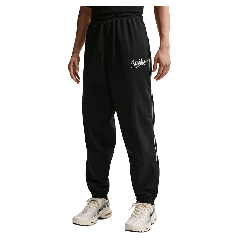 Main view of the Nike Club Lightweight Pants in Black and Khaki colourway, men model