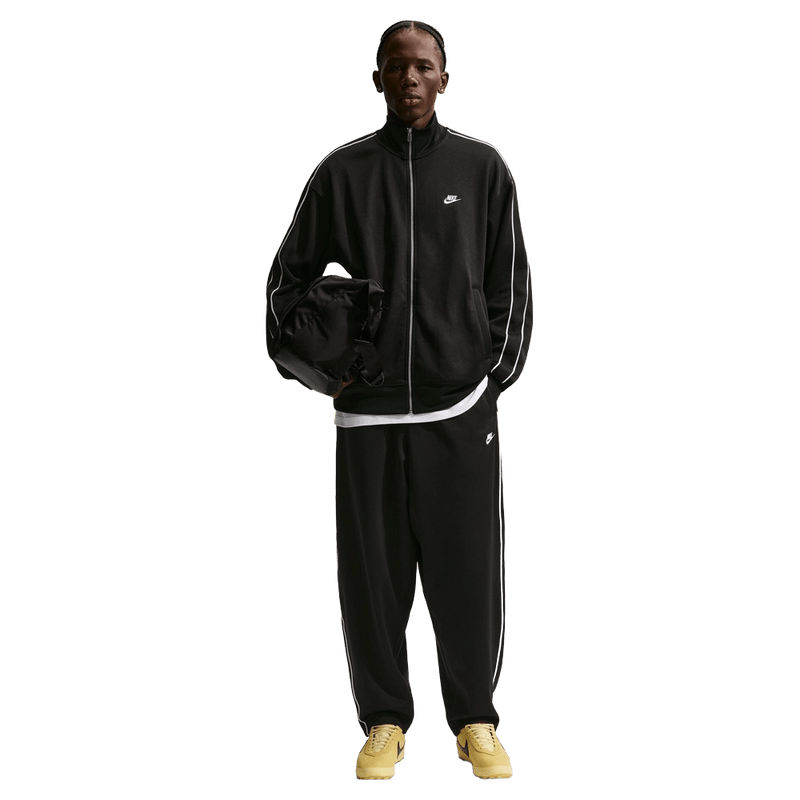 Front view of the Nike Club Track Sweatpants in Black and White colourway, men model