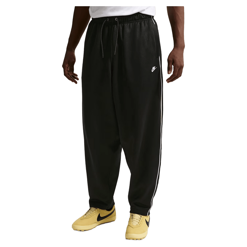Main view of the Nike Club Track Sweatpants in Black and White colourway, men model