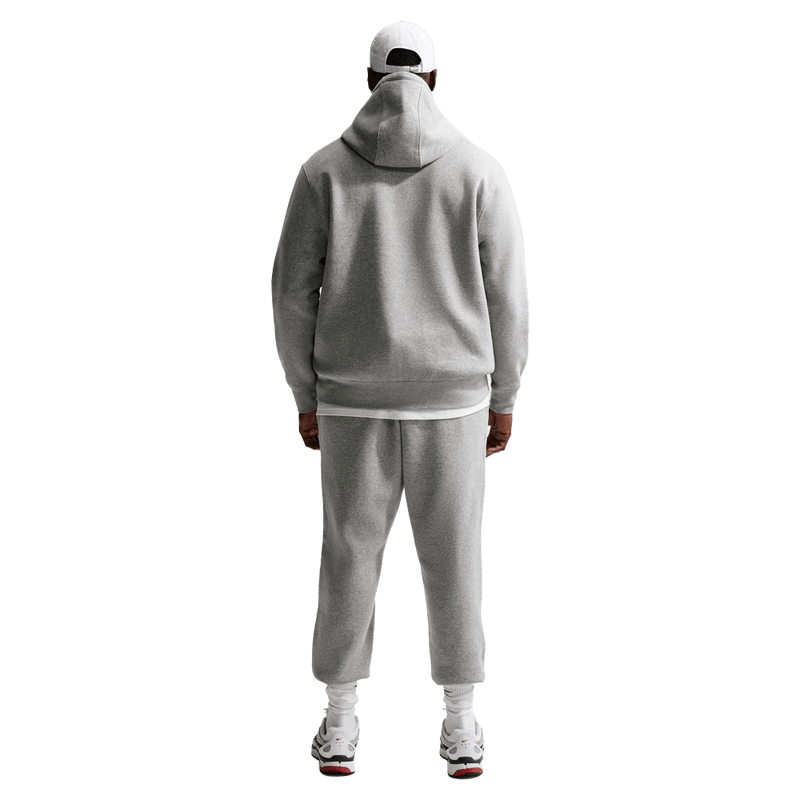 Back view of the Nike Club Track Sweatpants in Dark Grey Heather and light Smoke colourway, men model