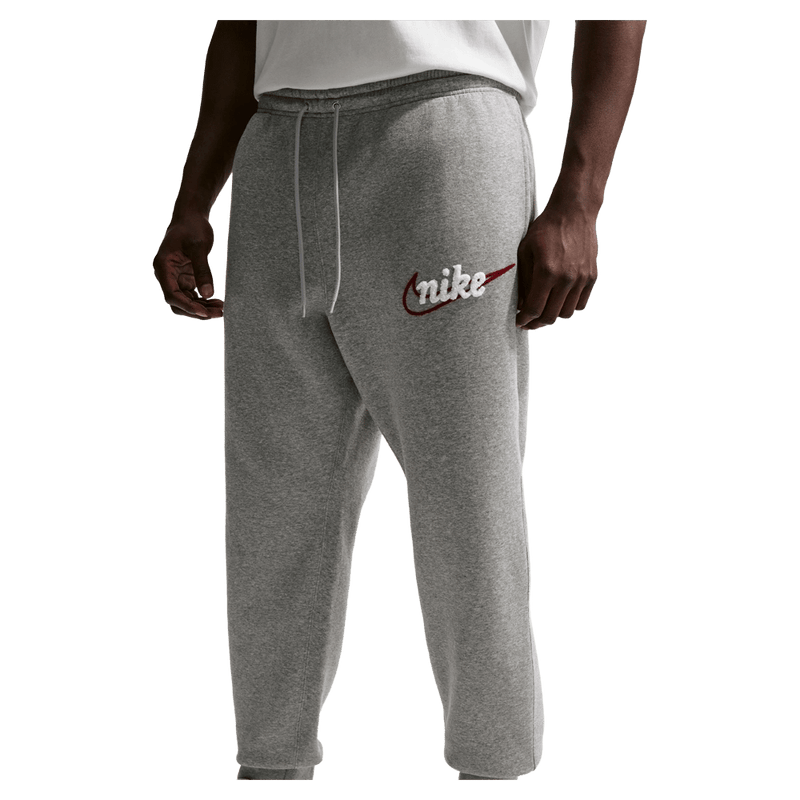 Main view of the Nike Club Track Sweatpants in Dark Grey Heather and light Smoke colourway, men model