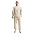 Front view of the Nike Club Track Sweatpants in Light Khaki and Obsidian colourway, men model