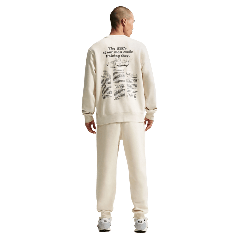 Back view of the Nike Club Track Sweatpants in Light Khaki and Obsidian colourway, men model