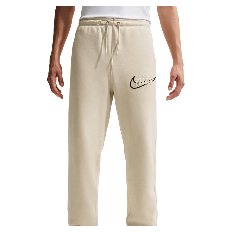 Main view of the Nike Club Track Sweatpants in Light Khaki and Obsidian colourway, men model
