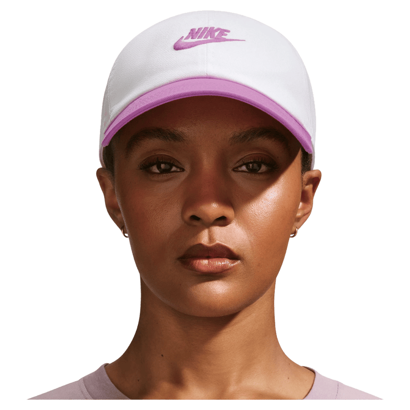 Main view of the Nike Club Cap in White and Lt Magenta colourway, unisex model