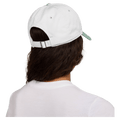 Back view of the Nike Club Cap in White and Steam colourway, unisex model