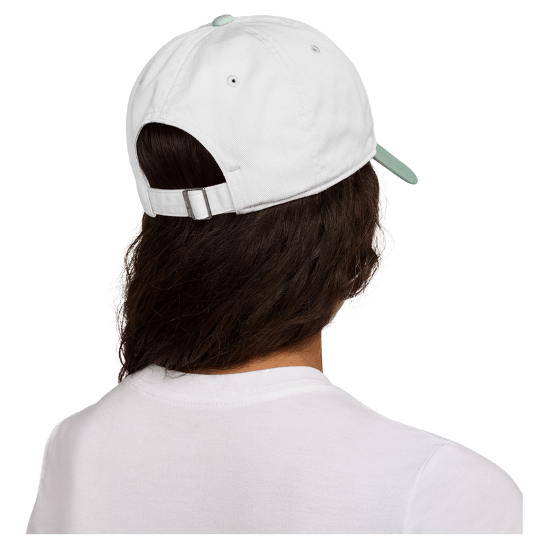 Back view of the Nike Club Cap in White and Steam colourway, unisex model