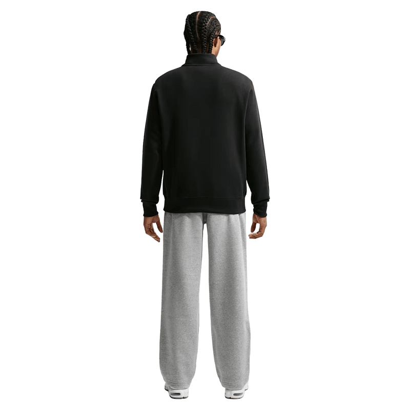 Back view of the Nike Club Fleece Pants in Dark Grey Heather colourway, men model