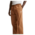 Main view of the Nike Club Pants in Ale Brown colourway, unisex model