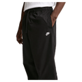 Main view of the Nike Club Pants in Black colourway, unisex model