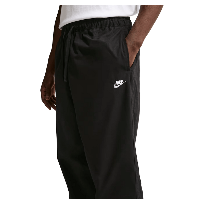 Main view of the Nike Club Pants in Black colourway, unisex model