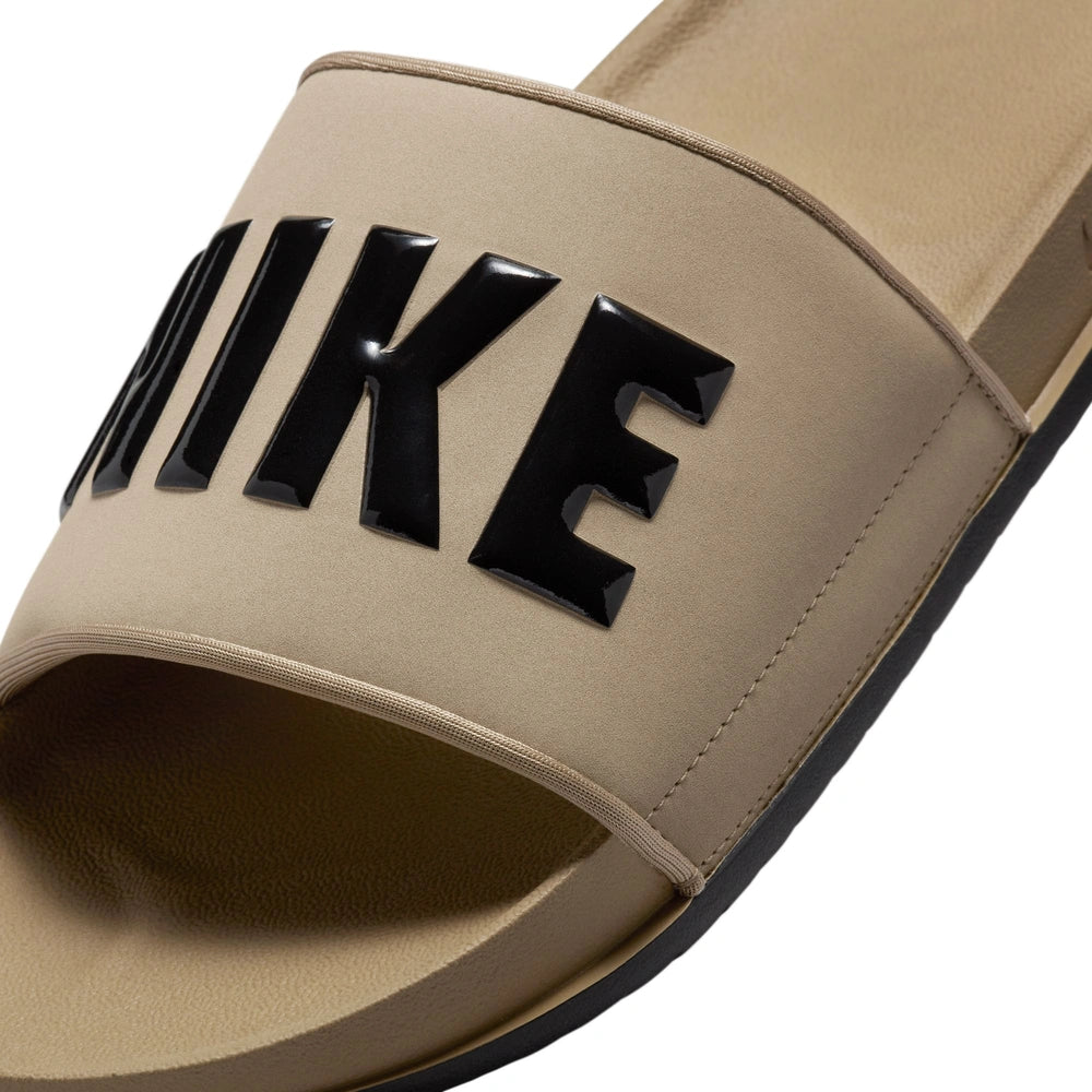 Close up image of the forefoot strap of a Nike Offcourt Slides in Khaki Black Black
